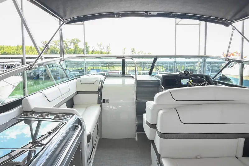 Slide: The Image of 2014 Formula 350 Sun Sport boat interior with white seating and modern dashboard. - 31