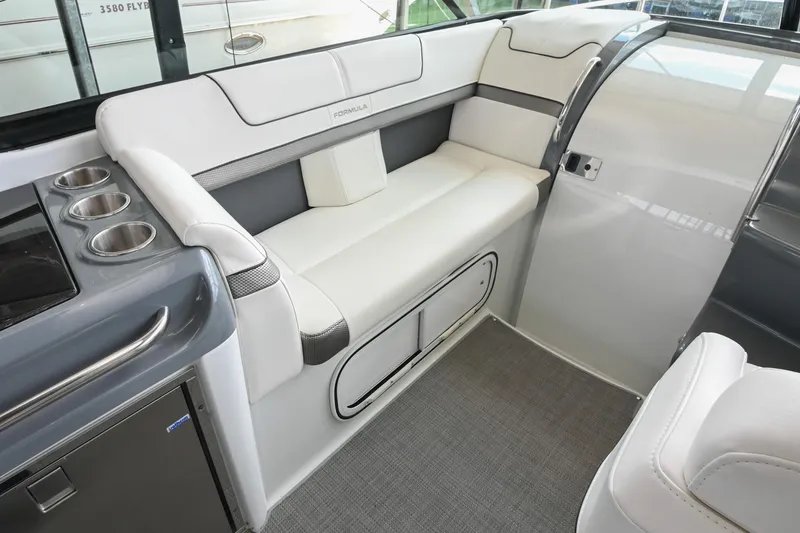 Slide: The Image of Interior of 2014 Formula 350 Sun Sport boat with white seating and cup holders. - 32