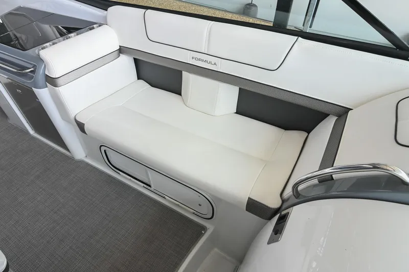 Slide: The Image of 2014 Formula 350 Sun Sport boat interior with white cushioned seating and sleek design. - 33