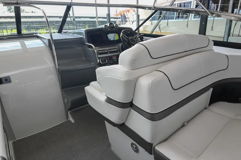 Slide: The Image of 2014 Formula 350 Sun Sport interior with white seating and modern dashboard. - 34