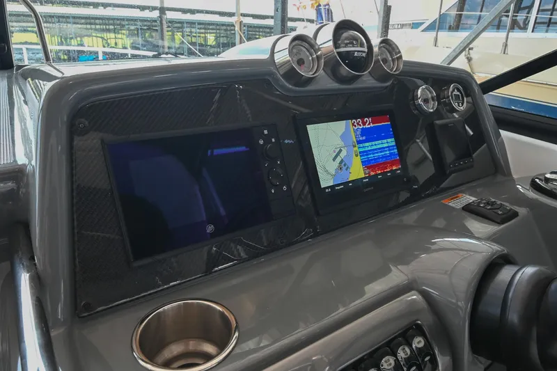 Slide: The Image of Dashboard of 2014 Formula 350 Sun Sport boat with navigation screens and gauges. - 36