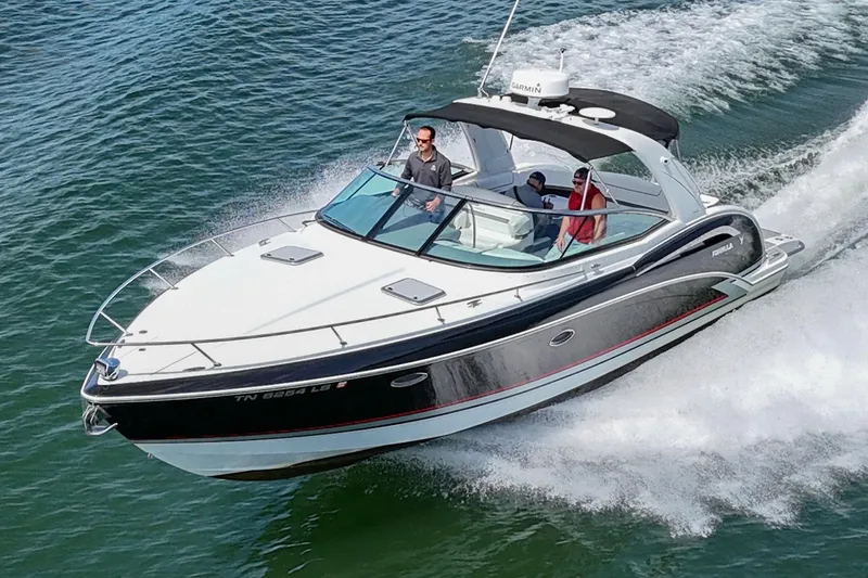 Slide: The Image of 2014 Formula 350 Sun Sport boat cruising on open water with passengers. - 4