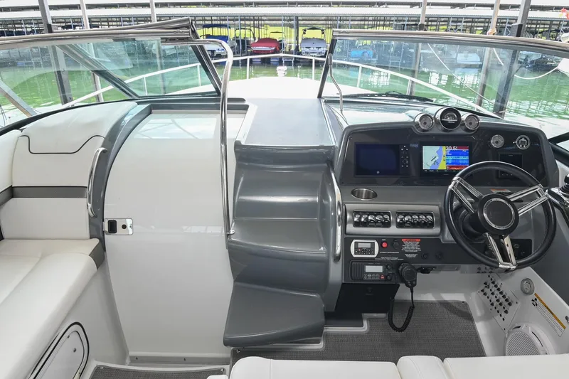 Slide: The Image of 2014 Formula 350 Sun Sport boat cockpit with modern navigation controls and steering wheel. - 41