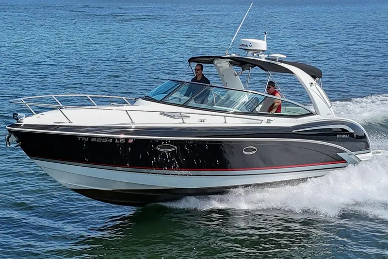 Slide: The Image of 2014 Formula 350 Sun Sport boat cruising on open water. - 5