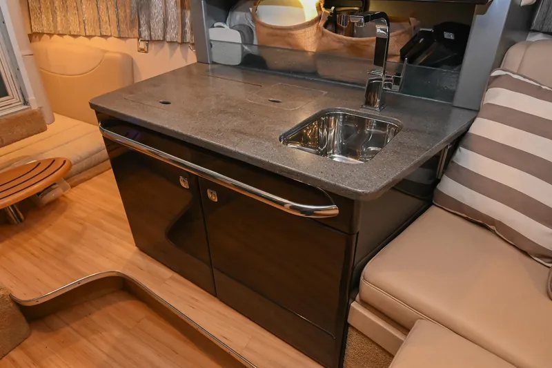 Slide: The Image of 2014 Formula 350 Sun Sport interior with sleek kitchenette and modern sink design. - 50