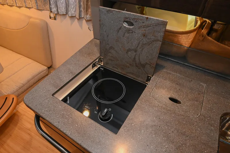 Slide: The Image of 2014 Formula 350 Sun Sport interior with compact stove and countertop. - 51