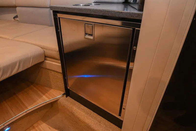 Slide: The Image of 2014 Formula 350 Sun Sport interior with stainless steel fridge and beige seating. - 54