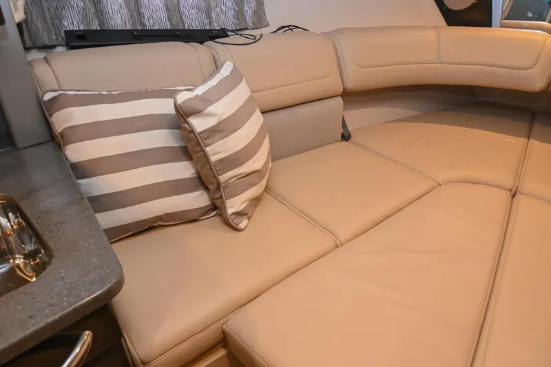 Slide: The Image of Interior of 2014 Formula 350 Sun Sport with beige leather seating and striped cushion. - 57