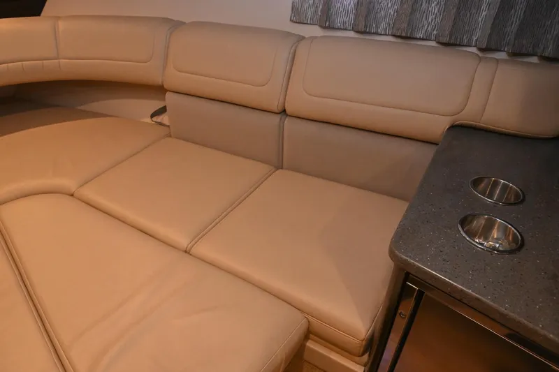 Slide: The Image of 2014 Formula 350 Sun Sport interior with beige leather seating and cup holders. - 59