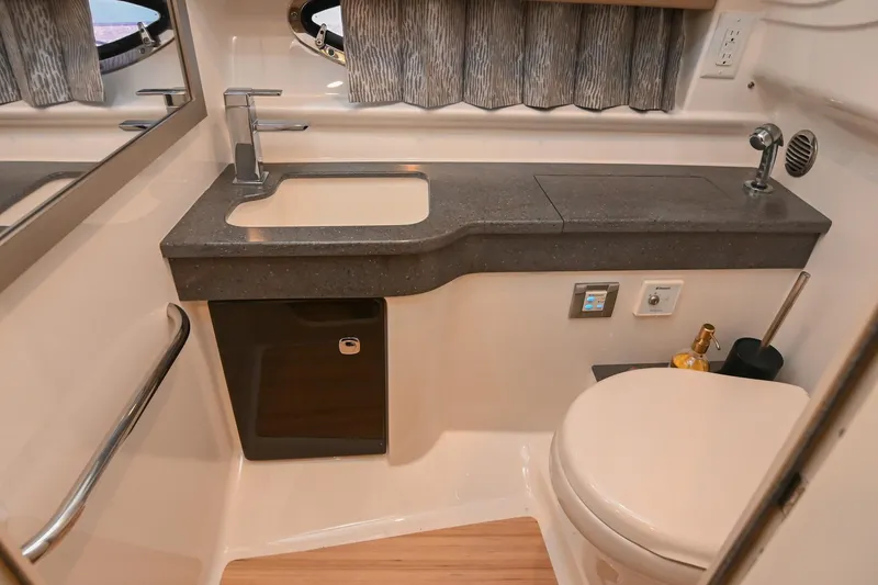 Slide: The Image of 2014 Formula 350 Sun Sport bathroom with modern sink, toilet, and countertop. - 64