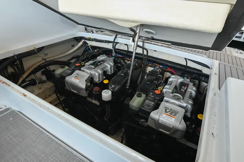 Slide: The Image of Engine compartment of a 2014 Formula 350 Sun Sport boat, featuring dual V8 engines. - 68