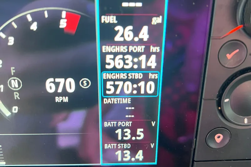 Slide: The Image of Dashboard of 2014 Formula 350 Sun Sport showing fuel, engine hours, and battery voltage. - 72