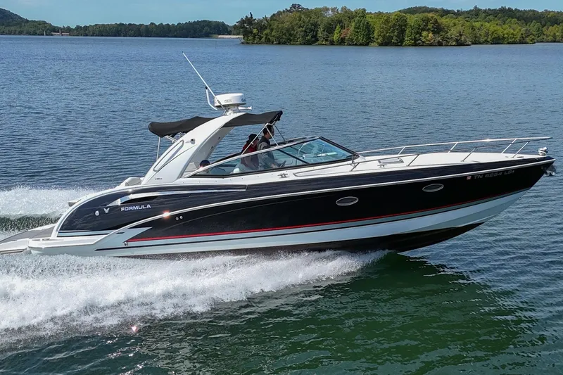 Slide: The Image of 2014 Formula 350 Sun Sport boat cruising on a scenic lake. - 75