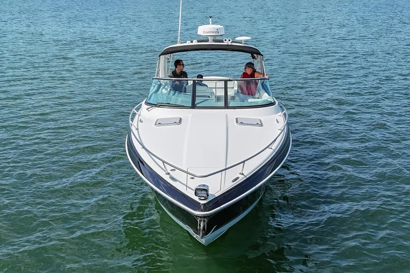 Slide: The Image of 2014 Formula 350 Sun Sport boat cruising on open water. - 8