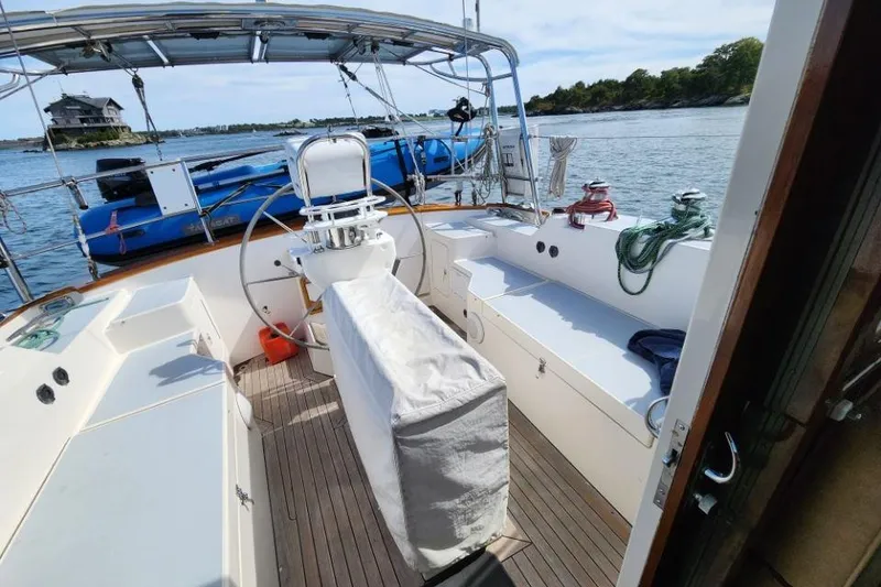 Slide: The Image of 2008 Bruckmann 50 MKII yacht cockpit with steering wheel, seating, and ocean view. - 13