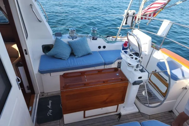 Slide: The Image of Cockpit of 2008 Bruckmann 50 MKII yacht with blue cushions and steering wheel. - 14