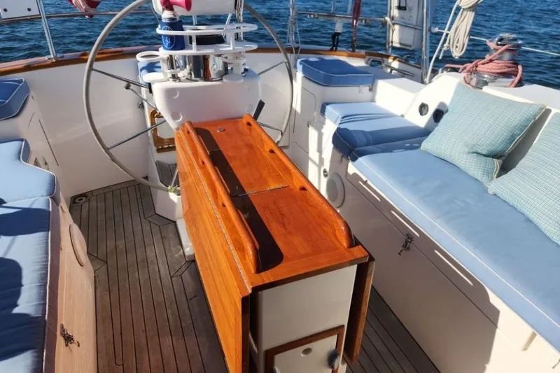 Slide: The Image of Cockpit of 2008 Bruckmann 50 MKII yacht with wooden table and cushioned seating. - 15