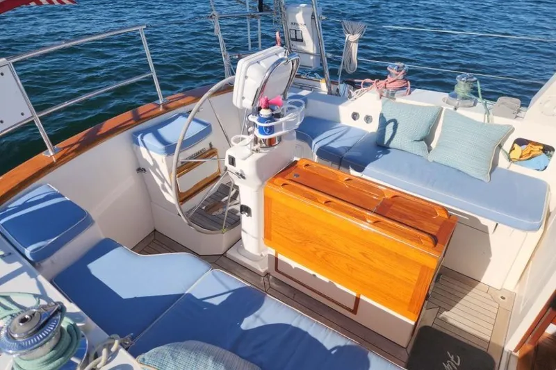 Slide: The Image of Luxurious 2008 Bruckmann 50 MKII yacht cockpit with blue cushions and wooden accents. - 16