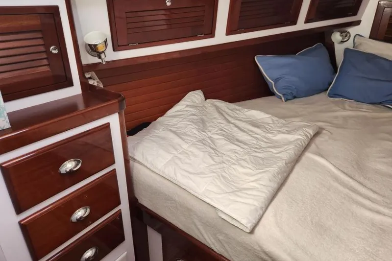 Slide: The Image of Luxurious cabin interior of 2008 Bruckmann 50 MKII yacht with wooden cabinetry and cozy bedding. - 22