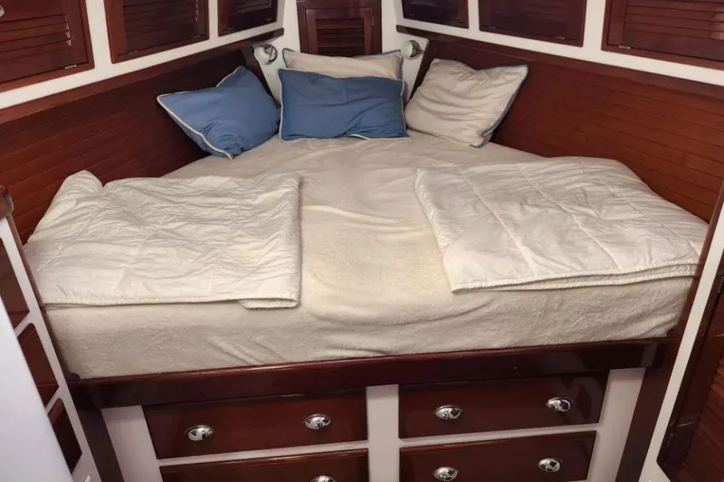 Slide: The Image of Cozy cabin bedroom in 2008 Bruckmann 50 MKII yacht with wooden accents and plush bedding. - 23