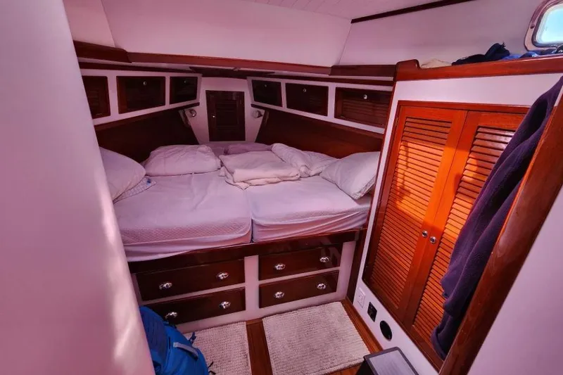 Slide: The Image of Cozy cabin interior of 2008 Bruckmann 50 MKII yacht with wooden accents and bedding. - 25
