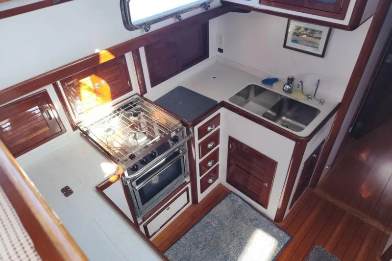 Slide: The Image of 2008 Bruckmann 50 MKII yacht kitchen with stove, sink, and wooden cabinetry. - 35
