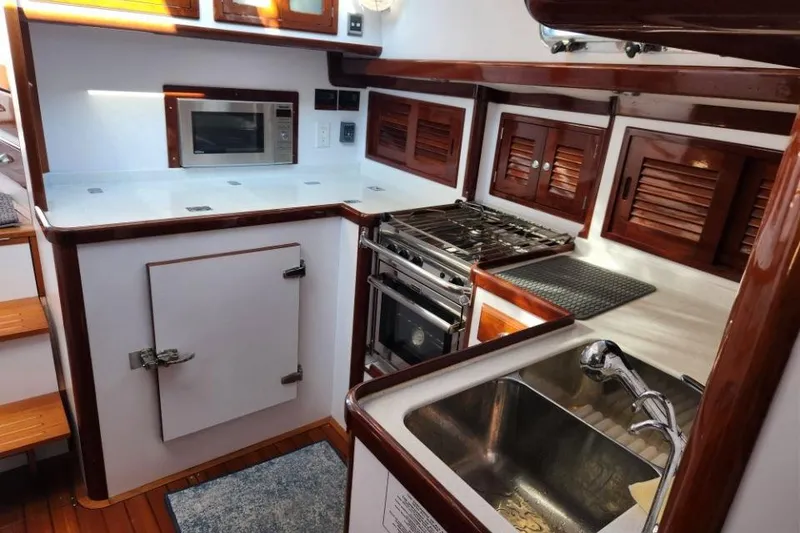 Slide: The Image of Luxurious 2008 Bruckmann 50 MKII yacht kitchen with stove, sink, and microwave. - 36