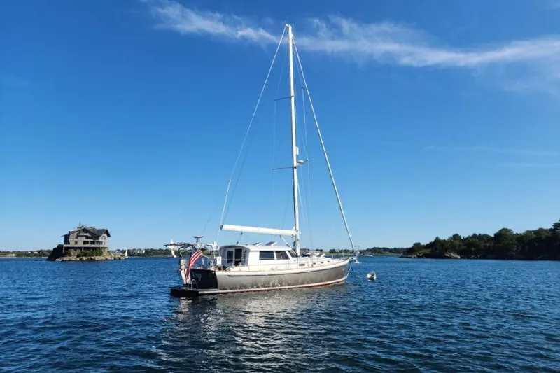 Slide: The Image of Sailboat Bruckmann 50 MKII 2008 anchored on a serene lake with clear blue skies. - 4