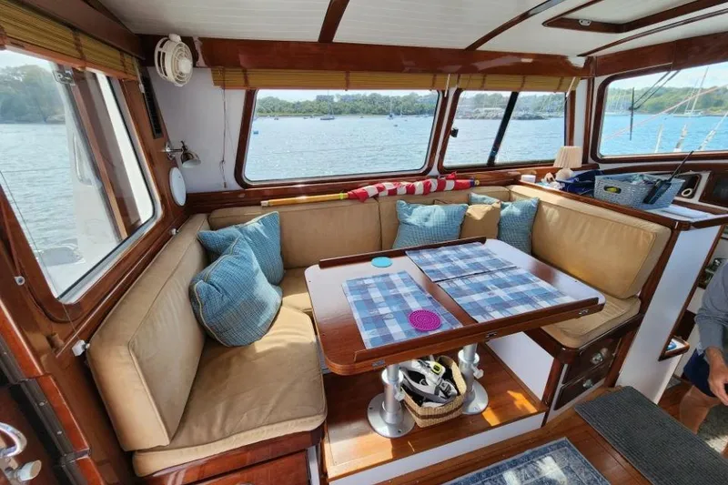 Slide: The Image of Cozy interior of 2008 Bruckmann 50 MKII yacht with cushioned seating and scenic window views. - 40