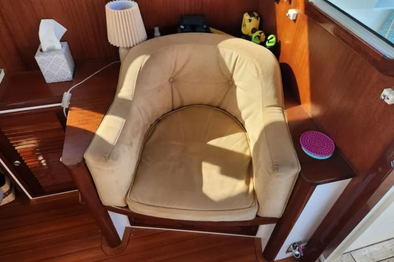 Slide: The Image of Cozy beige armchair in a 2008 Bruckmann 50 MKII yacht interior, with wooden accents. - 43