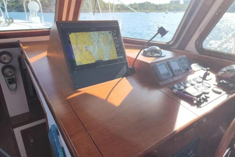 Slide: The Image of Navigation console of 2008 Bruckmann 50 MKII yacht with GPS and control instruments. - 46