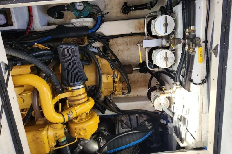 Slide: The Image of Engine compartment of a 2008 Bruckmann 50 MKII yacht, showcasing mechanical components. - 48