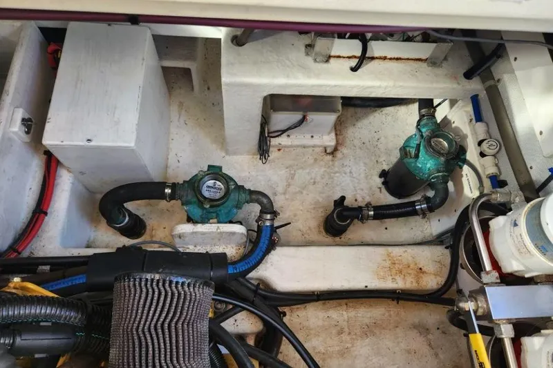 Slide: The Image of Engine compartment of a 2008 Bruckmann 50 MKII with visible pumps and wiring. - 50