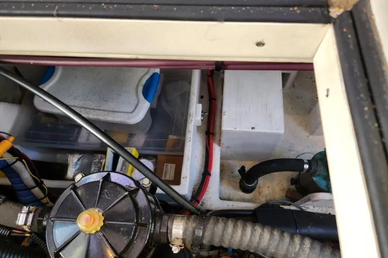 Slide: The Image of Engine compartment of a 2008 Bruckmann 50 MKII boat, showing various mechanical components. - 51