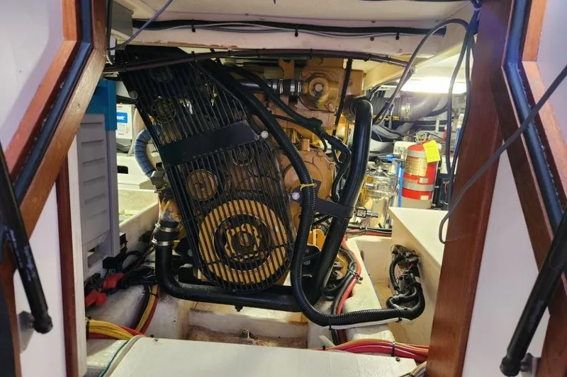 Slide: The Image of Engine room of a 2008 Bruckmann 50 MKII yacht, showcasing machinery and wiring. - 52