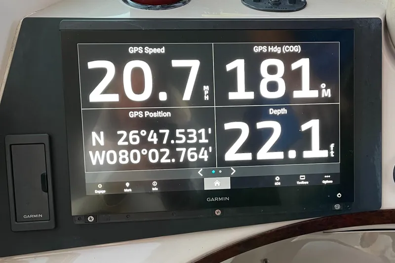 Slide: The Image of Garmin GPS display on 2005 Carver 56 Voyager showing speed, heading, position, and depth. - 12
