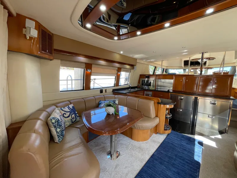 Slide: The Image of Luxurious interior of 2005 Carver 56 Voyager yacht with elegant seating and modern kitchen. - 19