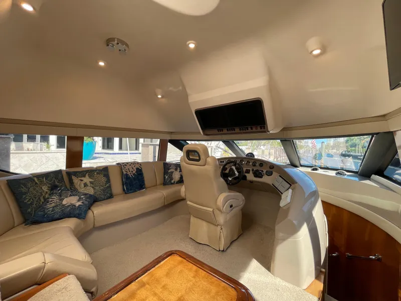 Slide: The Image of Luxurious interior of a 2005 Carver 56 Voyager yacht with plush seating and helm. - 22