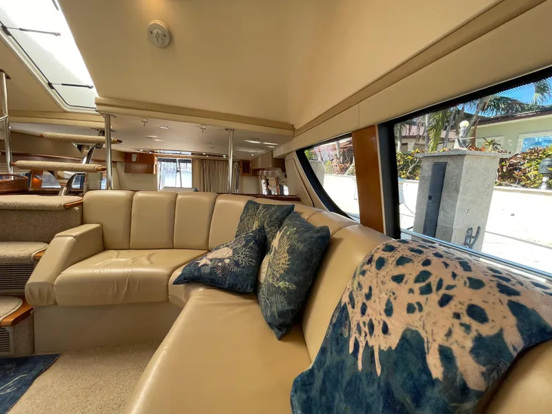 Slide: The Image of Luxurious interior of 2005 Carver 56 Voyager yacht with plush seating and decorative pillows. - 25