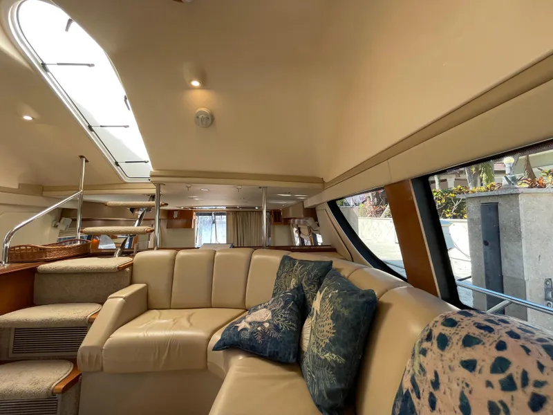 Slide: The Image of Luxurious interior of 2005 Carver 56 Voyager yacht with plush seating and elegant decor. - 27