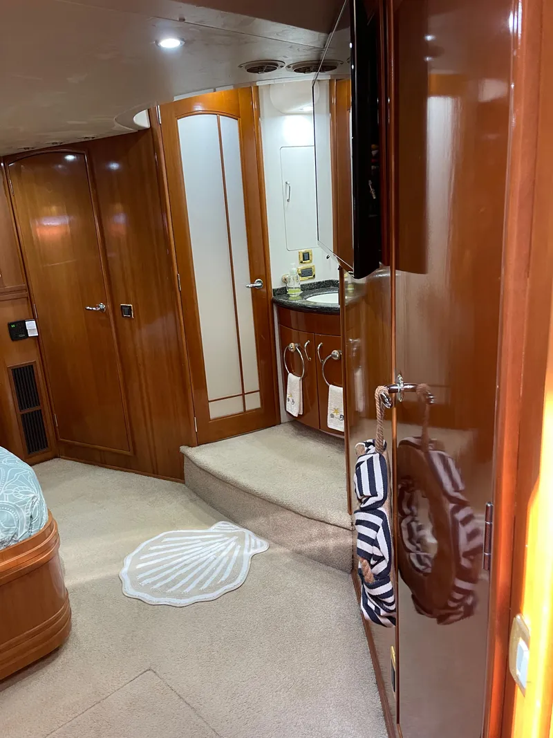 Slide: The Image of Interior of 2005 Carver 56 Voyager yacht with wood finishes and modern amenities. - 29