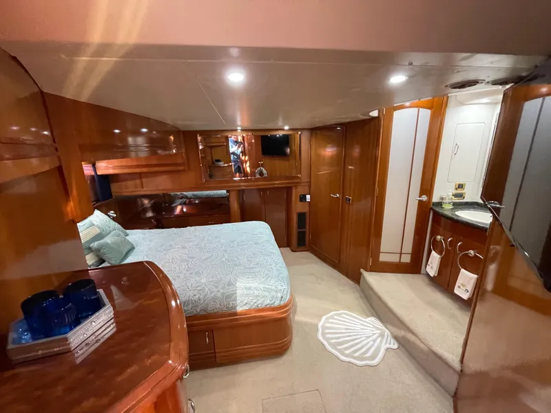 Slide: The Image of Luxurious interior of a 2005 Carver 56 Voyager yacht with elegant wood finishes. - 30