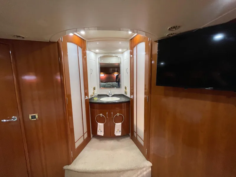 Slide: The Image of Luxurious interior of 2005 Carver 56 Voyager yacht with elegant wood finish and modern amenities. - 31