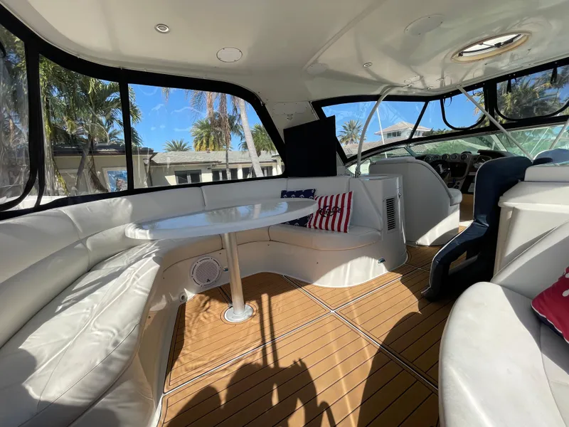 Slide: The Image of Luxurious interior of 2005 Carver 56 Voyager yacht with white seating and wooden flooring. - 35