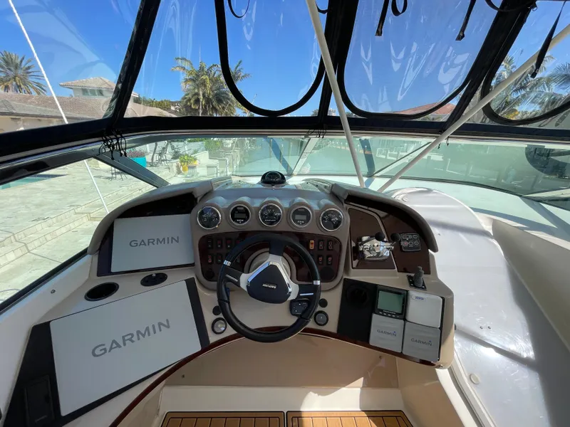 Slide: The Image of 2005 Carver 56 Voyager helm with Garmin navigation system and steering wheel. - 36