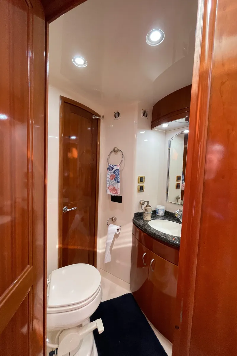 Slide: The Image of 2005 Carver 56 Voyager yacht bathroom with wood accents and modern fixtures. - 38