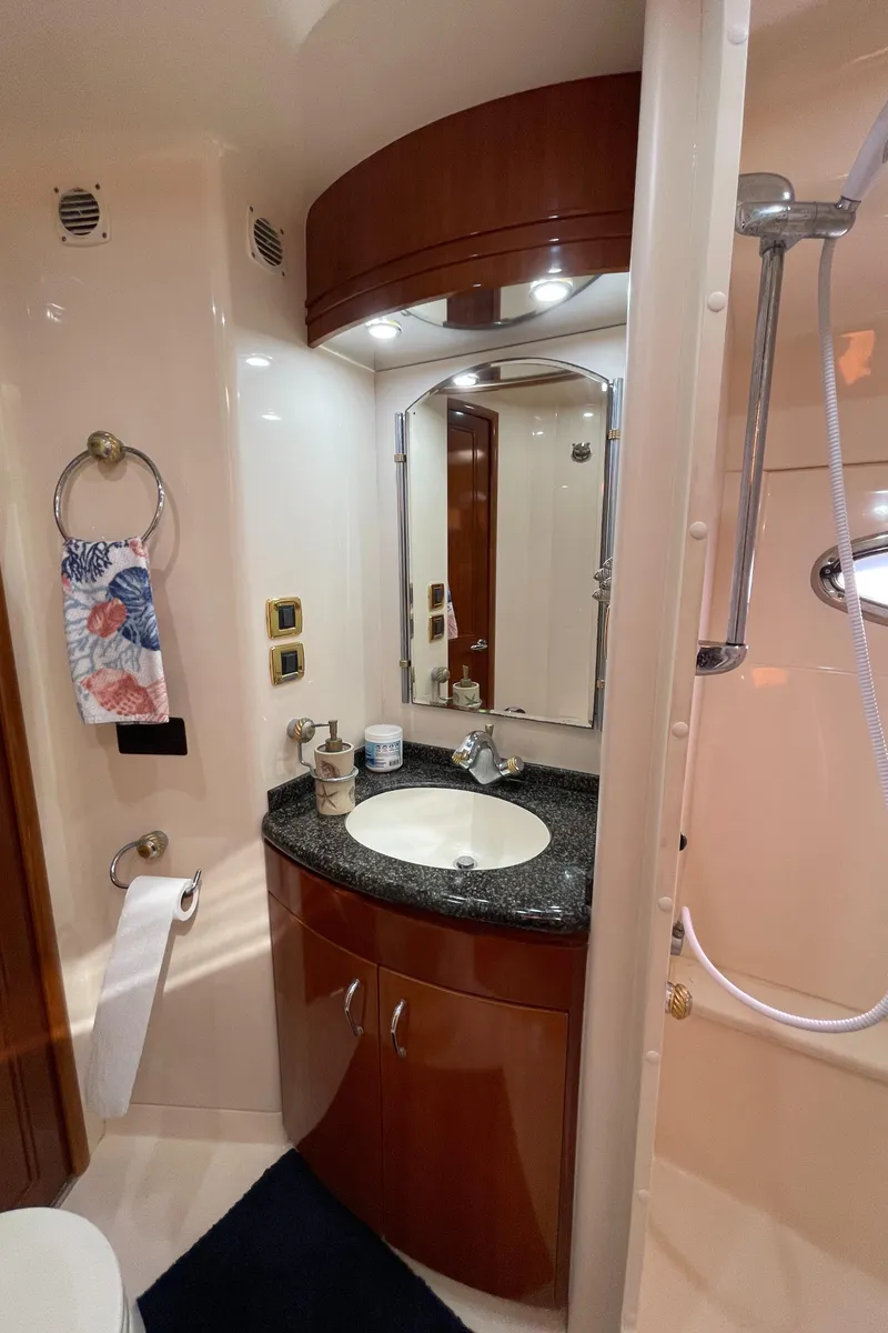 Slide: The Image of 2005 Carver 56 Voyager bathroom with sink, mirror, and shower. - 39