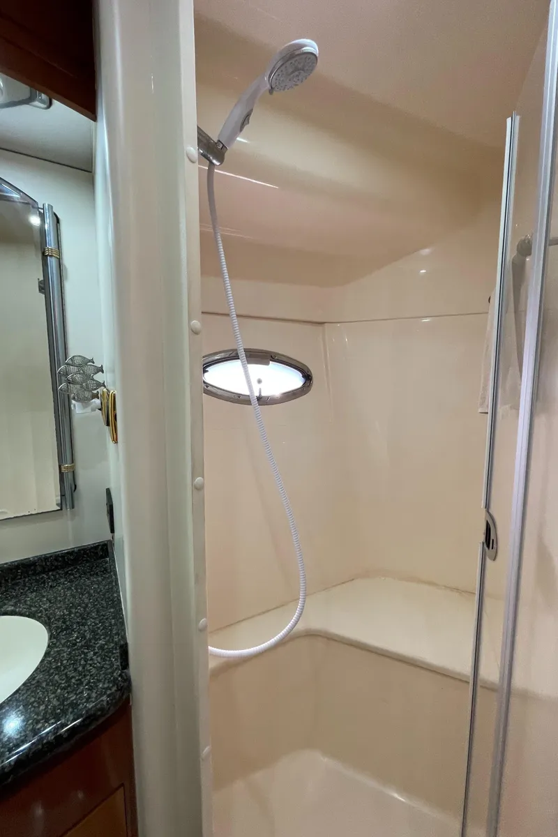 Slide: The Image of Shower area in 2005 Carver 56 Voyager yacht with sleek design and modern fixtures. - 40