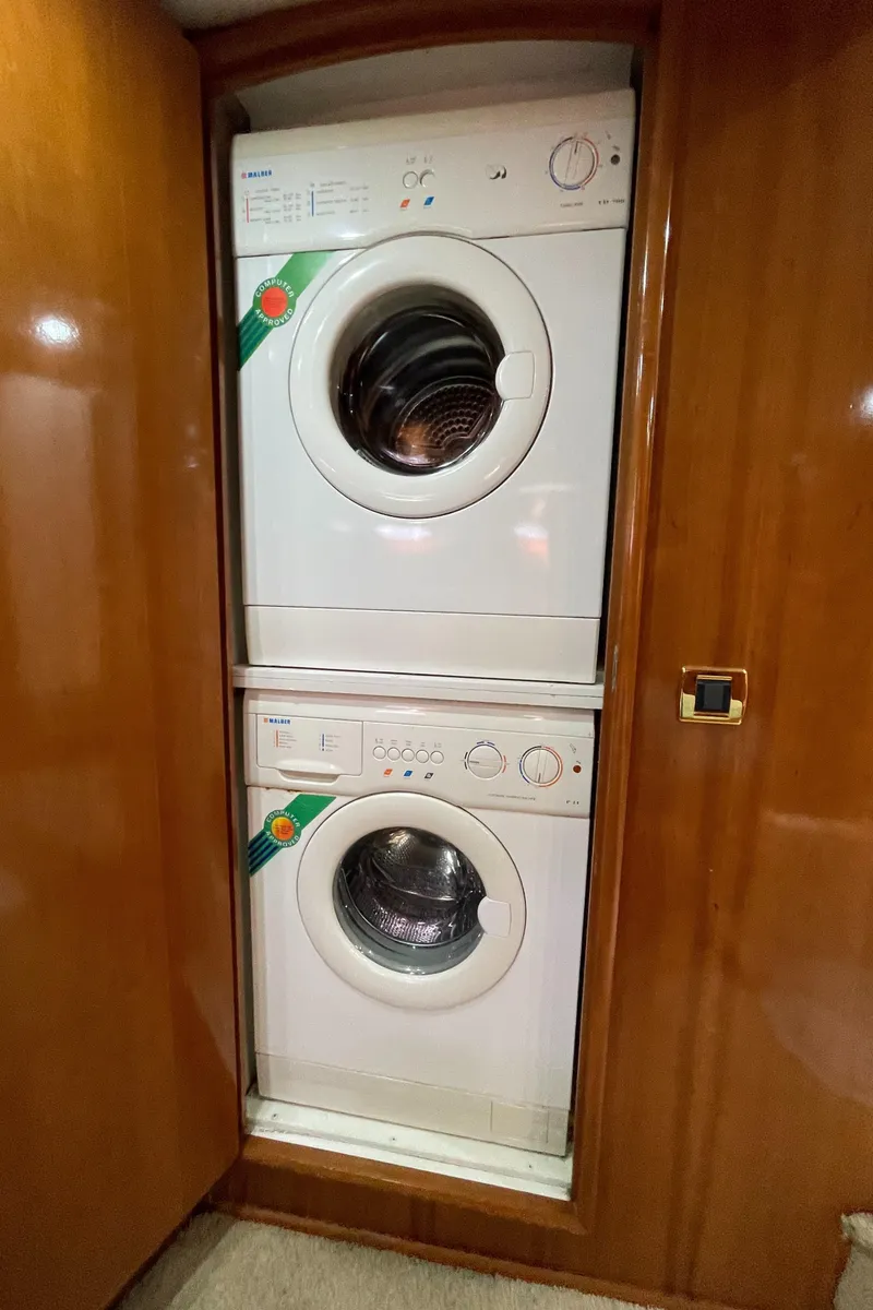 Slide: The Image of Stacked washer and dryer inside 2005 Carver 56 Voyager yacht. - 43