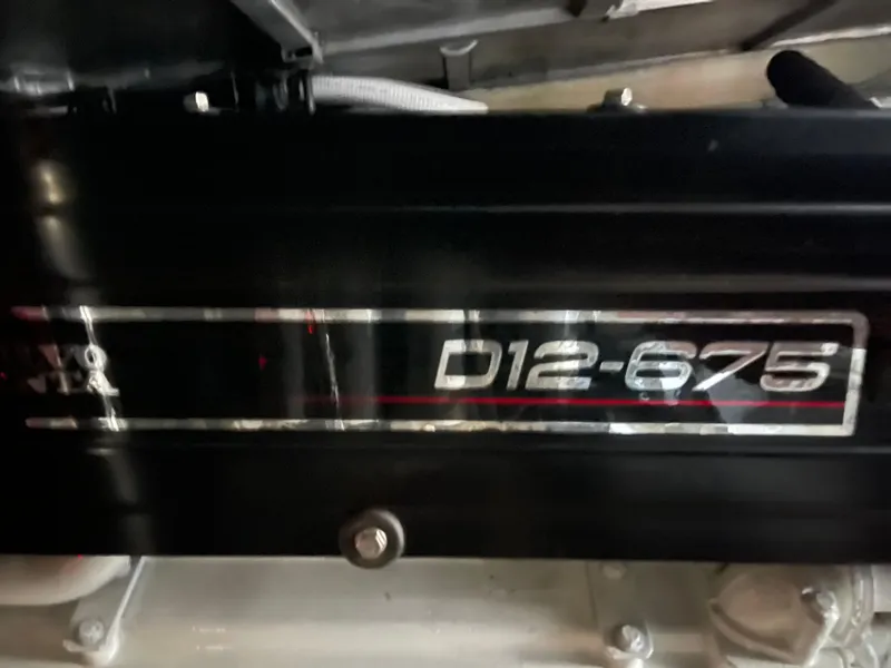 Slide: The Image of Close-up of a 2005 Carver 56 Voyager engine, featuring D12-675 V8 label. - 44